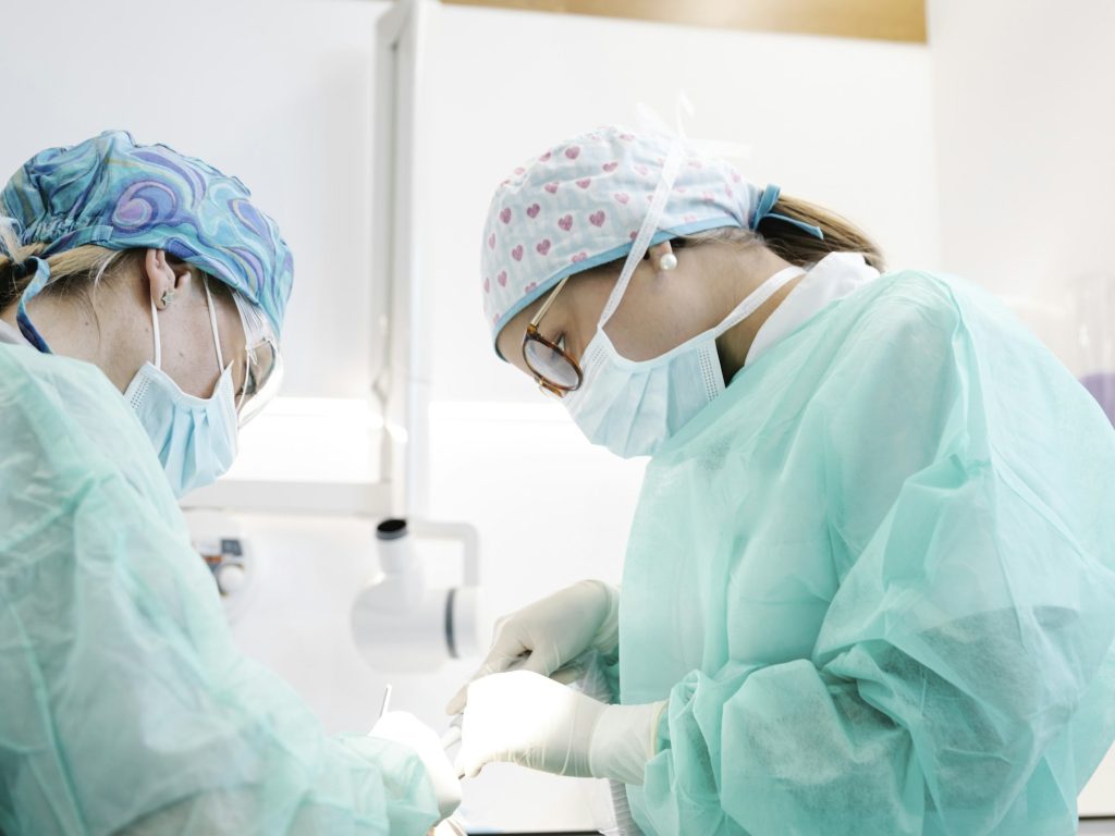 Dentists making surgery in clinic